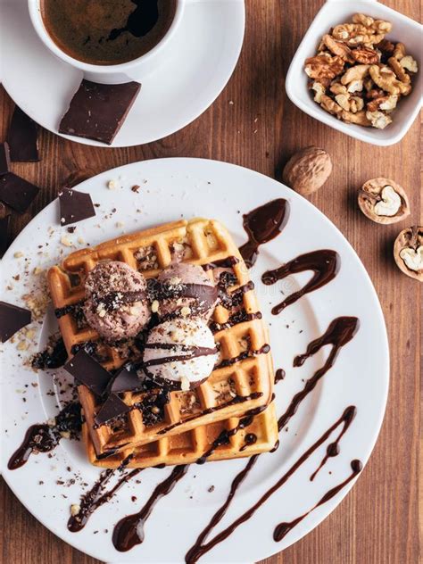 Belgian Waffles with Ice Cream. Chocolate and Nuts. Wooden Table Stock ...