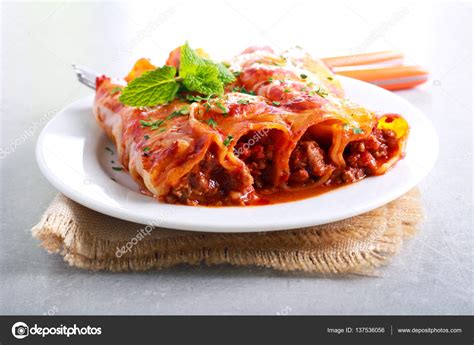 Beef cannelloni with tomato sauce — Stock Photo © manyakotic #137536056