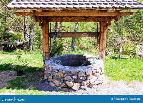 Old Stone Well of a Rustic Garden Stock Photo - Image of country, ancient: 106334382