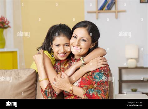 Girl hugging her mother Stock Photo - Alamy