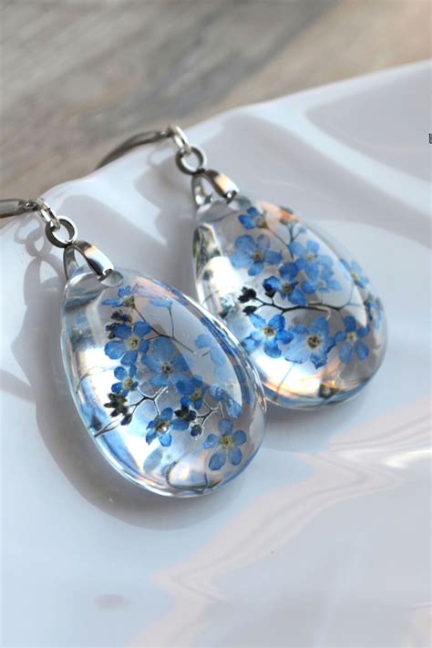 Handmade earrings made from real forget-me-not flowers. | Flower resin jewelry, Diy jewelry ...