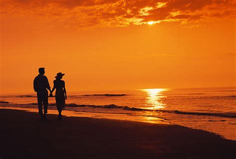 HD wallpaper: sunset, sea, beach, the evening, two, silhouettes, couple, walking | Wallpaper Flare