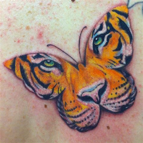 Butterfly tiger face tattoo | Tiger butterfly tattoo, Tiger face tattoo, Tiger eyes tattoo