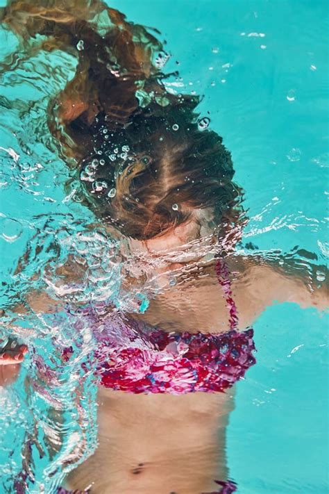 Young Woman Immersing Herself in Water Stock Image - Image of joying, copy: 155794359