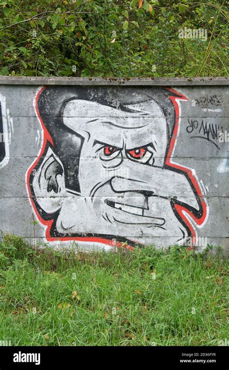 “Yo Manu” political satire. Spray painted graffiti caricature mocking French President Emmanuel ...