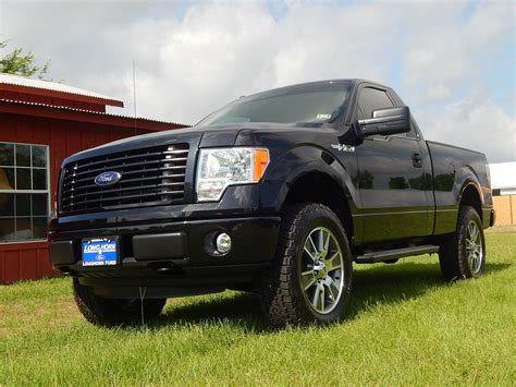 2014 Ford F-150 STX Regular Cab 4X4 with a custom leveling kit, 20-inch Nitto tires, custom ...