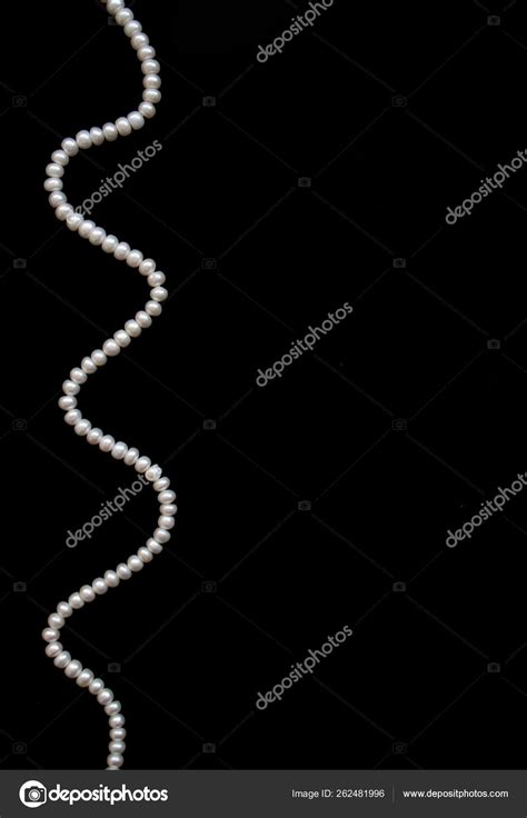 White Pearls Black Silk Background Stock Photo by ©YAYImages 262481996