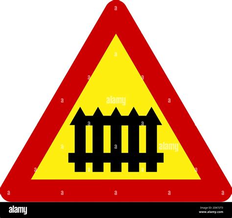 Warning sign with level crossing symbol Stock Photo - Alamy