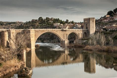 Bridge Reflects In River Of Toledo, Spain, Europe. Stock Image - Image of crossing, blue: 27566165