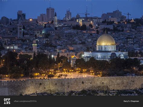 The Dome of the Rock against the Jerusalem skyline at night stock photo - OFFSET