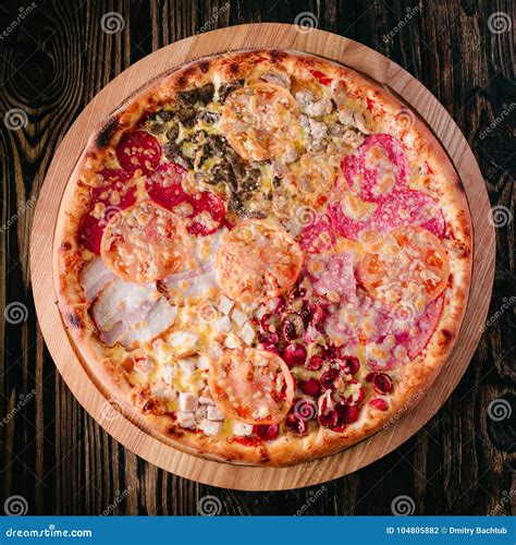 Pizza on a cutting board stock photo. Image of edible - 104805882