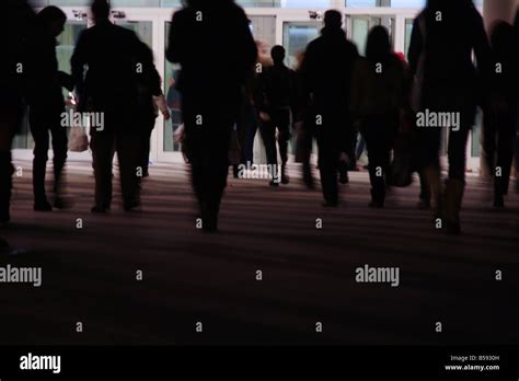 crowd of people walking in street at night Stock Photo - Alamy