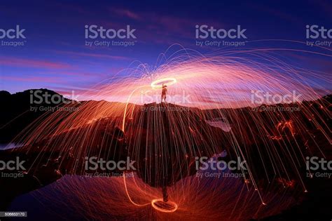 Spinning Fire On The Beach 4 Stock Photo - Download Image Now - Beach, Bizarre, Burning - iStock