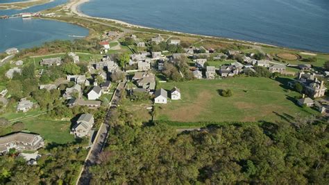 6K stock footage aerial video orbiting coastal community, Cuttyhunk Island, Elisabeth Islands ...