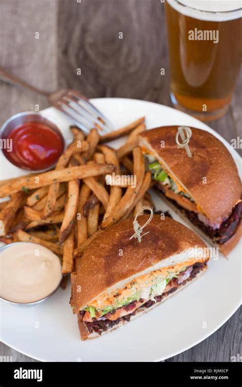 Vegan Burger, Fries and a Beer Stock Photo - Alamy