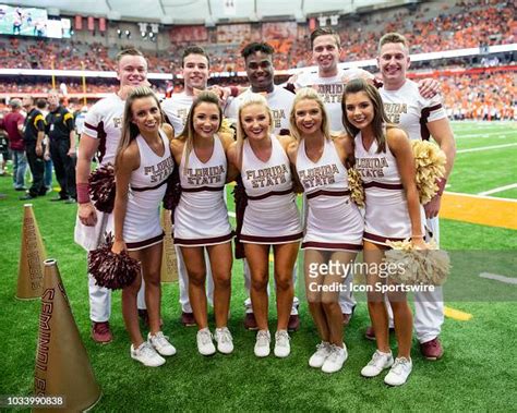 Members of the Florida State Seminoles Cheerleaders pose for a... News ...