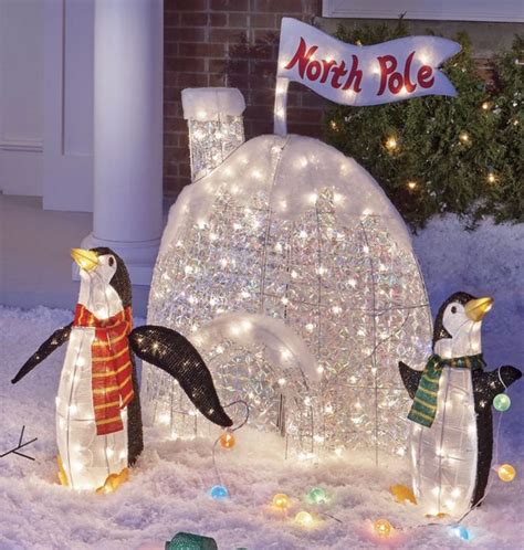 Light up your front yard with this adorable penguin igloo! This penguin pair welcomes your gue ...