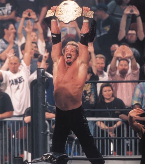 DDP raises his championship belt