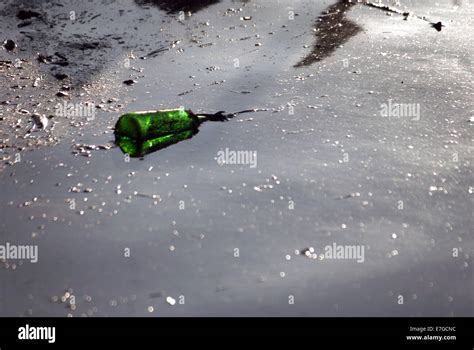 Discarded plastic bottle in canal / Rubbish Stock Photo - Alamy