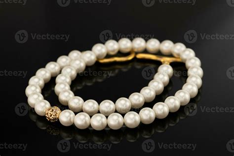 Pearl Necklace on Black Background 24347099 Stock Photo at Vecteezy