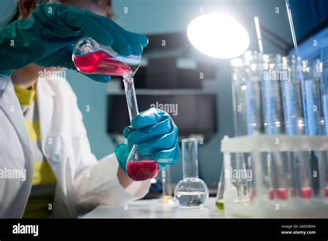 Laboratorian with flasks and tubes Stock Photo - Alamy