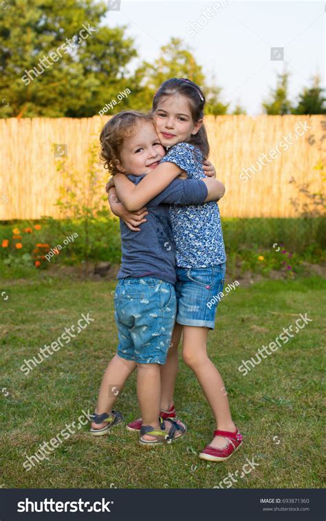 Happy Little Kids Hugging Each Other Stock Photo 693871360 | Shutterstock