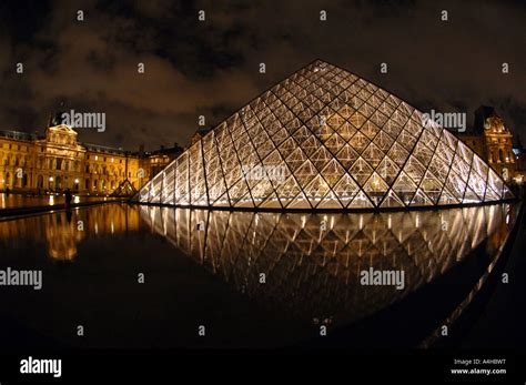 The Louvre museum at night in Paris France Stock Photo - Alamy