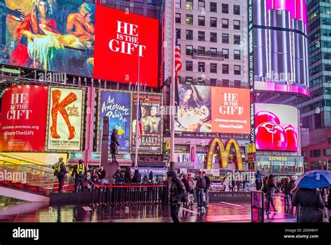 Crowded Times Square in Midtown Manhattan at Night. Bright LED Screens ...