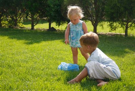 Kids Playing On Green Grass Stock Photo - Image: 14701110