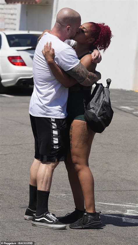 Chet Hanks and MMA fighter girlfriend Melissa Maysing hold hands and kiss after working out in ...