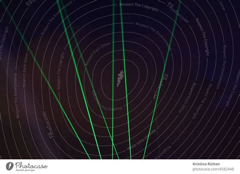 laser beams in the night sky - a Royalty Free Stock Photo from Photocase