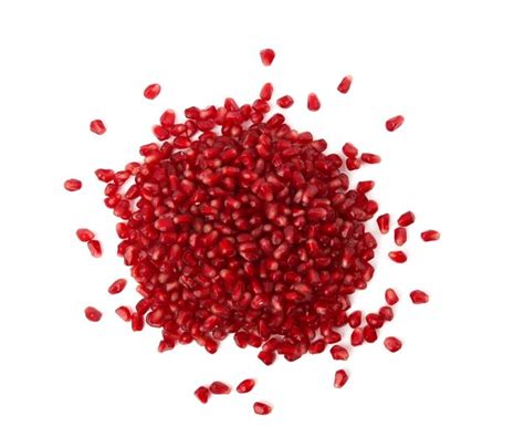 Premium Photo | Pomegranate seeds on white