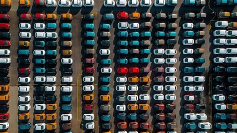 Premium Photo | Aerial view of a parking lot with a lot of cars ...