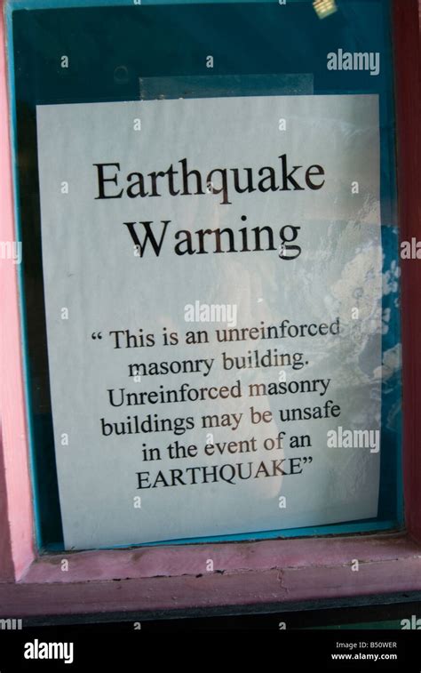 Sign "Earthquake Warning" at a building in Monterey, California Stock Photo - Alamy