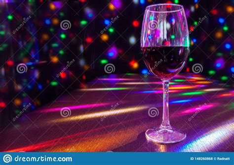 Glass of Wine on the Table with Bright Festive Lighting Stock Photo - Image of party, alcohol ...