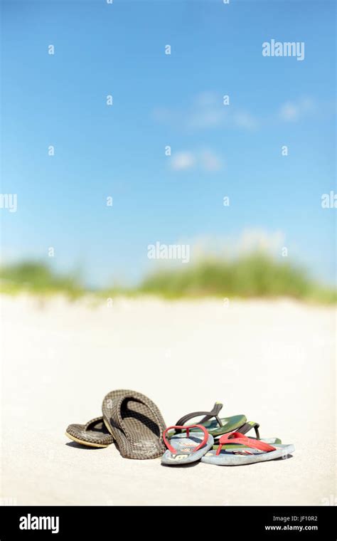 Flip flops on beach Stock Photo - Alamy