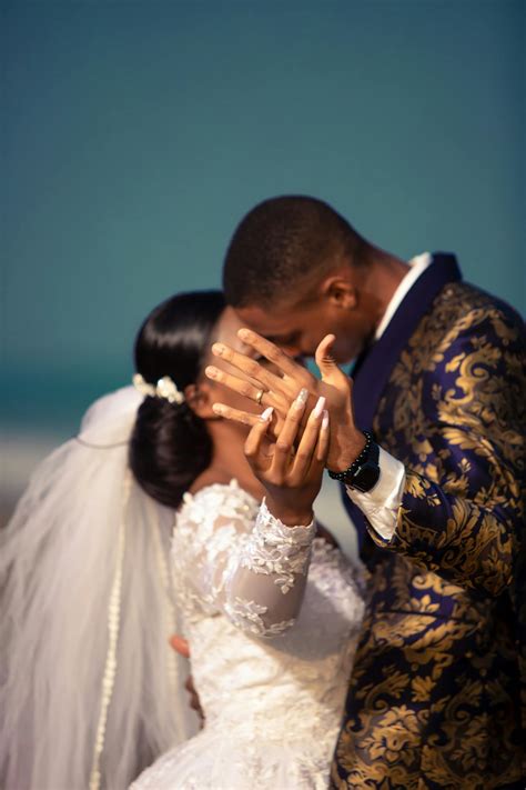 Wedding black couple kissing and showing ring on ring finger · Free ...