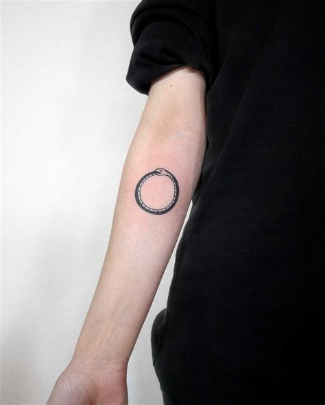 Simple Ouroboros tattoo by Ann Gilberg tattooed on the right forearm ...