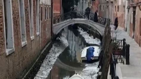 Unusually low water levels in Venice canals... just months after heavy flooding hit the city ...