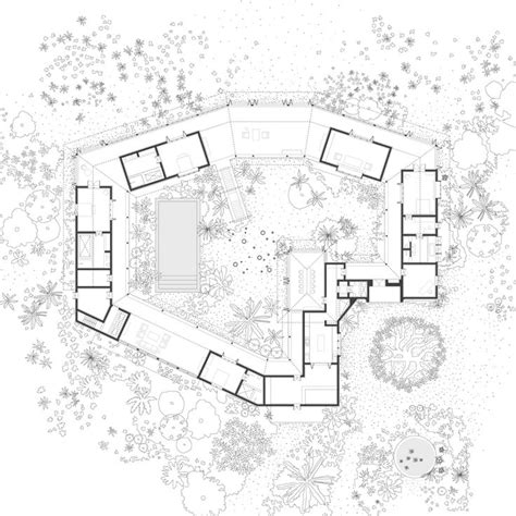 an aerial view of the house and its surrounding courtyard