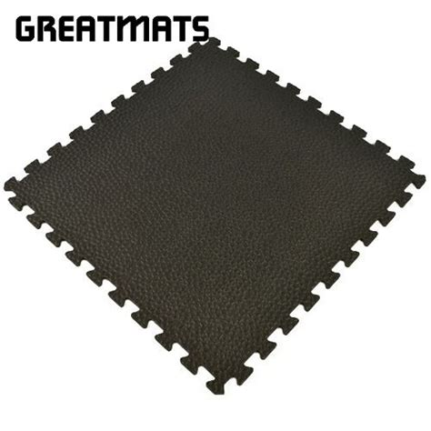 These rugged, high-density EVA foam gym mats for home features a pebble top surface design that ...