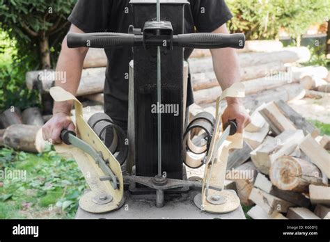 Firewood split with wooden splitter Stock Photo - Alamy