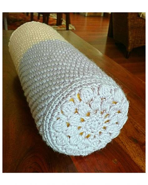 Here's the bolster cushion in its entirety, with its crochet cover. I'm afraid the pictures are ...