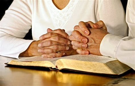 Couple Praying with Holy Bible Stock Photo - Image of devotion, person: 100091710