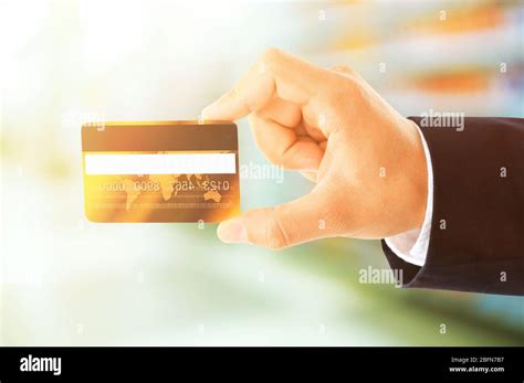 Hand holding credit card, isolated on white Stock Photo - Alamy