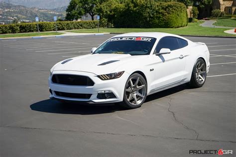 White Mustang GT sitting on GT350R style wheels with custom Brushed Titanium Finish : Mustang