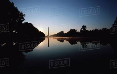 Reflection of a monument on water, Washington Monument, Washington DC ...