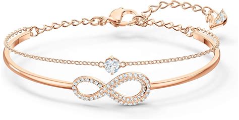 SWAROVSKI Women's Infinity Knot Rose-gold Finish Bangle Bracelet, White Crystal: Swarovski ...