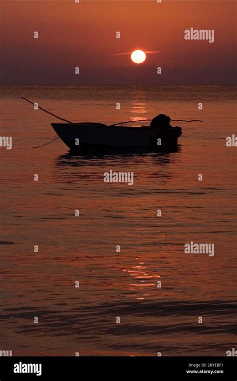 boat sunset red Stock Photo - Alamy