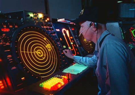 U.S. Navy air traffic controller watches his radar scope on board the USS George Washington (CVN ...